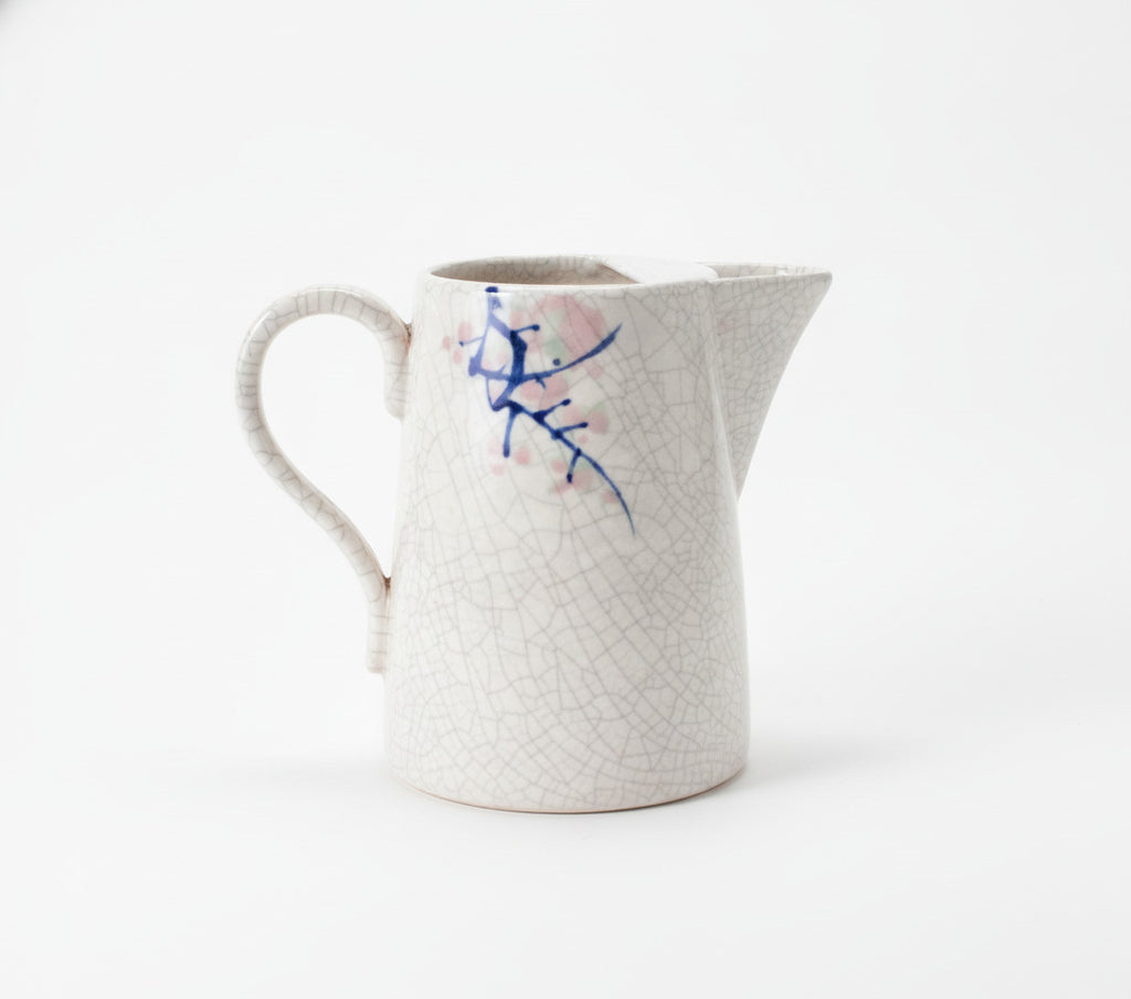 Vintage Ceramic Pitcher with Crackle Glaze and Blue Branch Design