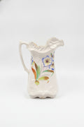 Vintage Ceramic Pitcher with Hand-Painted Floral Design and Scalloped Rim